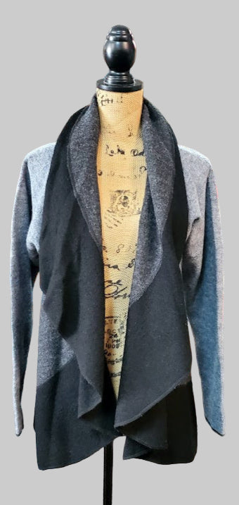 Gray cardigan on a mannequin in a store setting