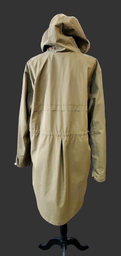 Beige trench coat on a mannequin in a clothing store setting