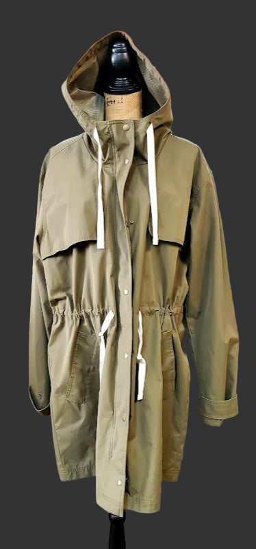 Green raincoat on a mannequin in a clothing store setting