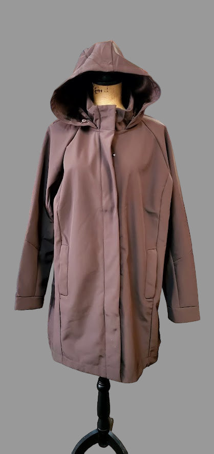 raincoat on a mannequin against a gray background